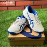 white and blue cricket shoes from Asics